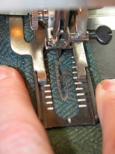 Very slightly spread the buttonhole lips apart while the presser foot is still in the down position.