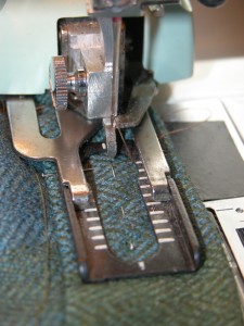 Lower the presser foot securely over the area where the buttonhole goes...