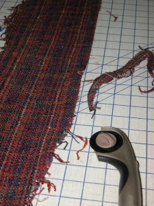 Cut one inch strips of fabric on grain.