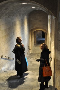 Exiting down the vaulted corridor to the street entrance